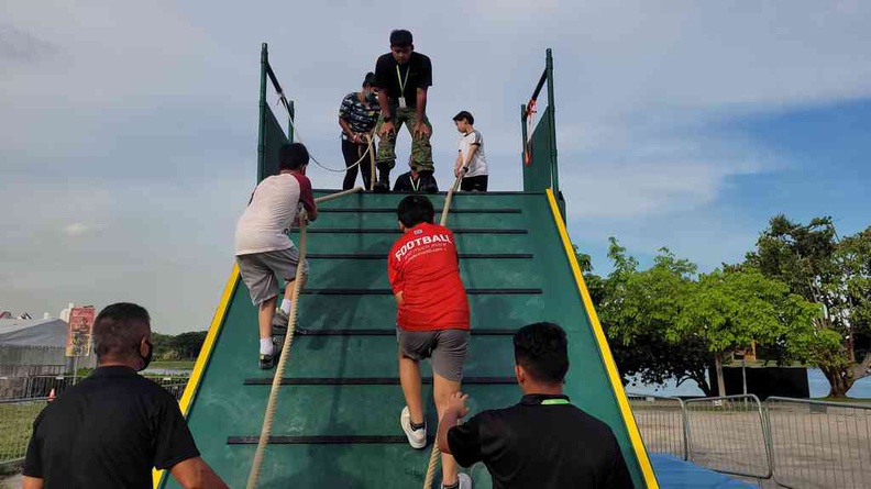 Going up the high wall element and a favourite obstacle in the course