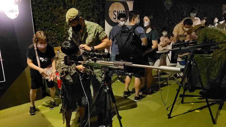 Have a go dressed in a sniper ghillie suit and aiming with a real sniper rifle