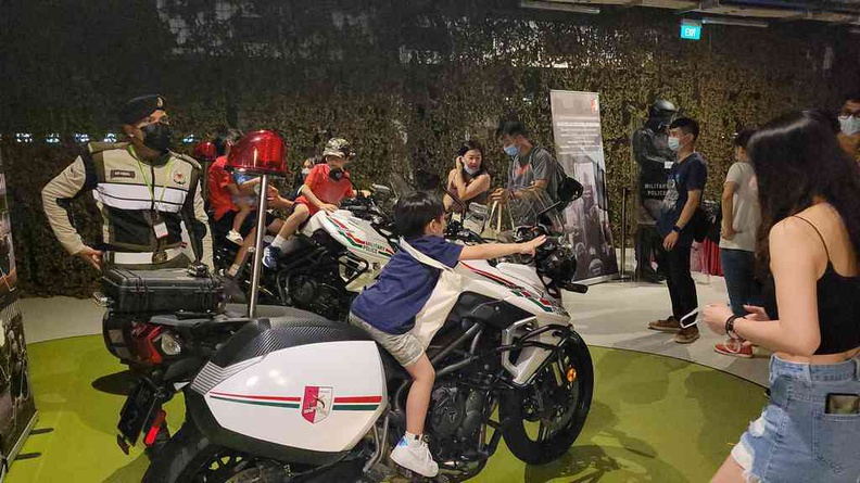 Have a photo on the patrol motorbike at the Military police display booth