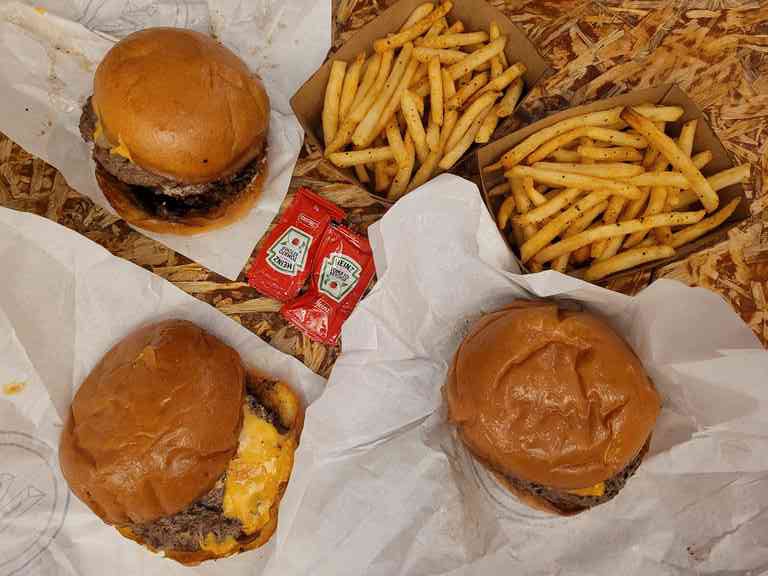 A trio of burgers at Wildfire Burgers NAFA