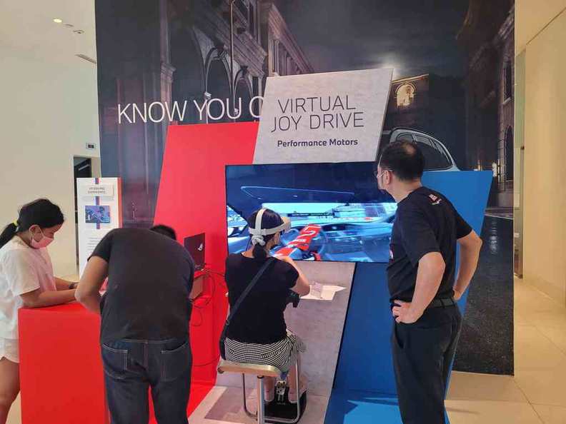 Have a go racing on a virtual race track using Virtual reality headsets at BMW Performance motors Joyfest 2022
