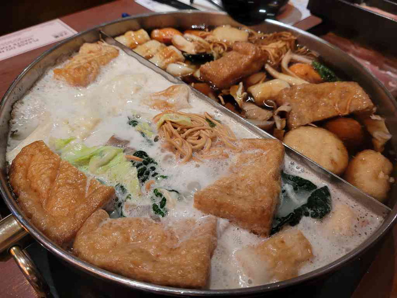 Suki-ya split pot with 2 soups bases, Sukiyaki and Butaniku soup stock loaded with ingredients
