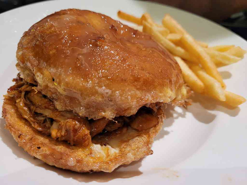 XW Honey pulled chicken slider burgers between two oily fried buns