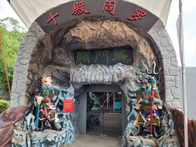 Entrance to the Haw Par Villa Hell's museum 10 courts of hell with Ox-Head and Horse-Face