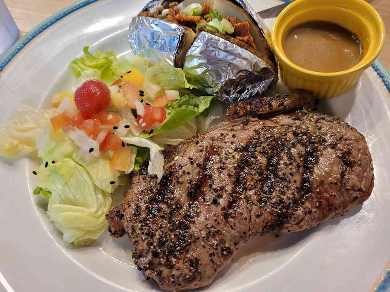 Sirloin steak medium done ($18) with salad and baked potato side