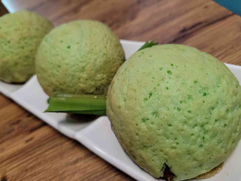 Signature pandan crispy pork bun, a fine baked offering $6 per plate