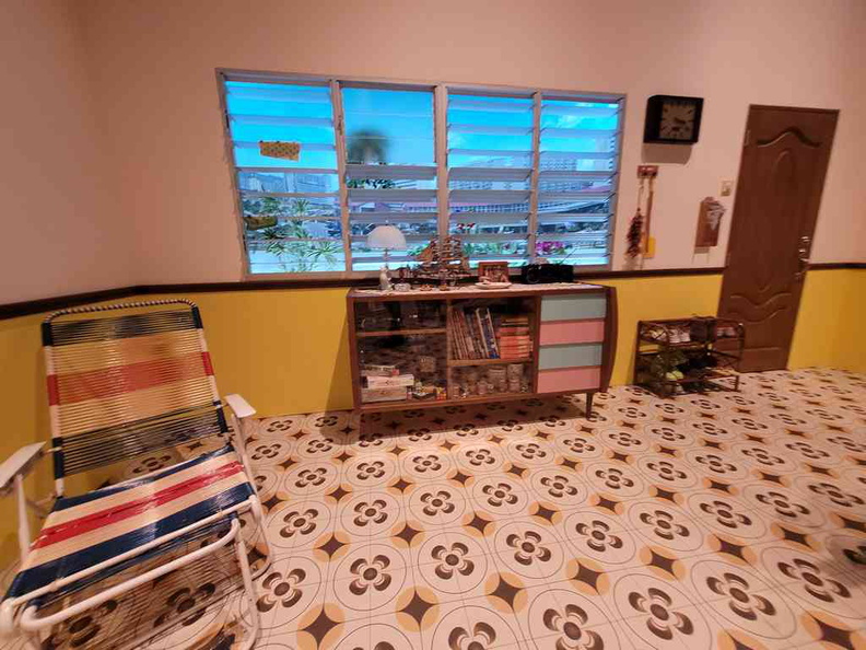 An 80s-style TV living room with the wire bench chair at the OFF ON Everyday Technology