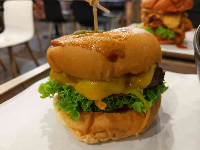 The loaded Grilled Chicken Burger ($15) packed with enoki mushrooms and lots of melted cheese