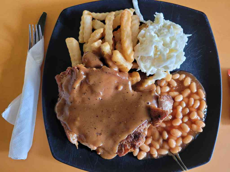 Grilled Chicken chop with brown sauce, crinkle fries, colesaw and baked beans ($7)