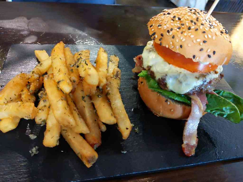 Knots Beef Burger ($18). A beef and bacon gourmet burger with a side of garnished fries