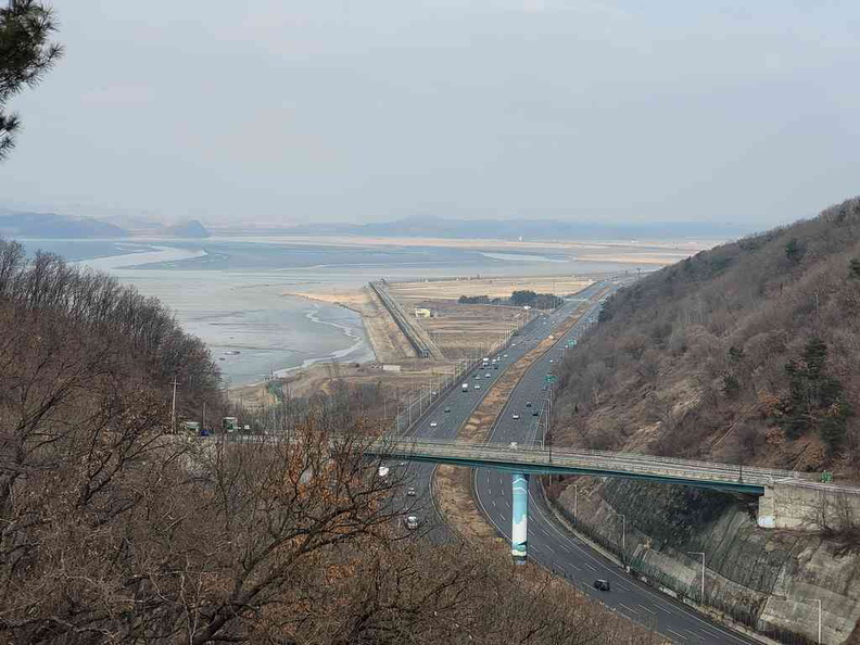 Highway on top of Odusan Mountain with a central highway in view, a stark development contrast to the North in the horizon
