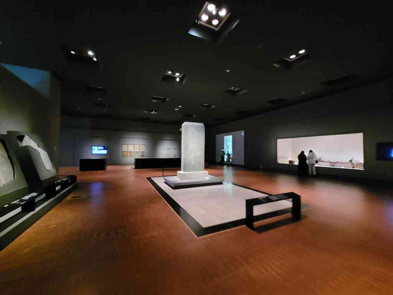 Vast interior galleries of the National Museum of Korea, with large standing artifacts and behind glass