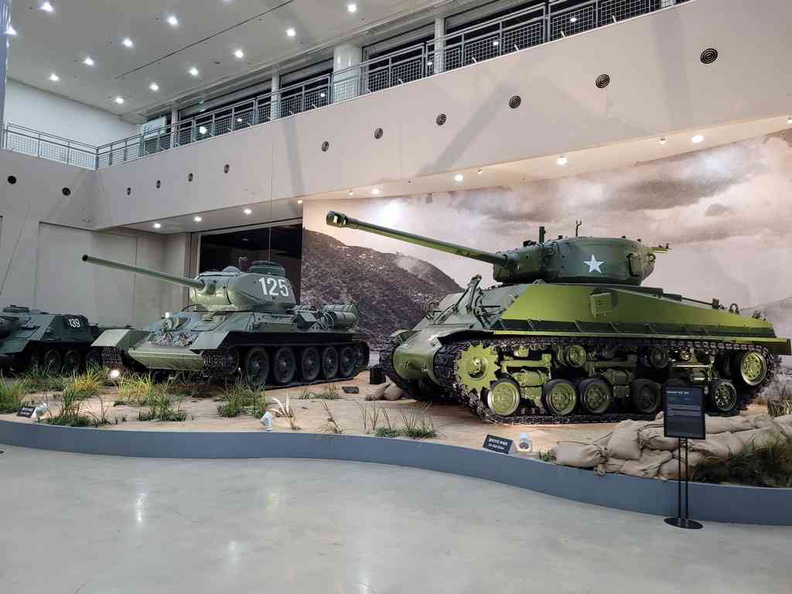 Indoor tank display with a Sherman tank and captured Russian T-34