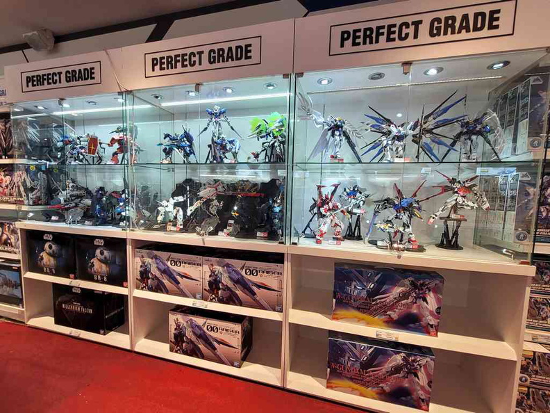 Perfect grade models on display within the Gundam Base store