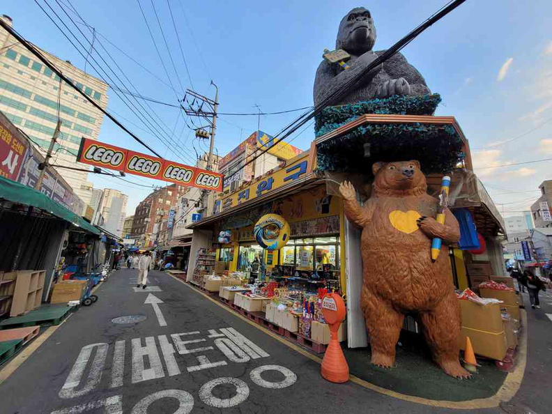 Peculiar toy store with animals at a junction.