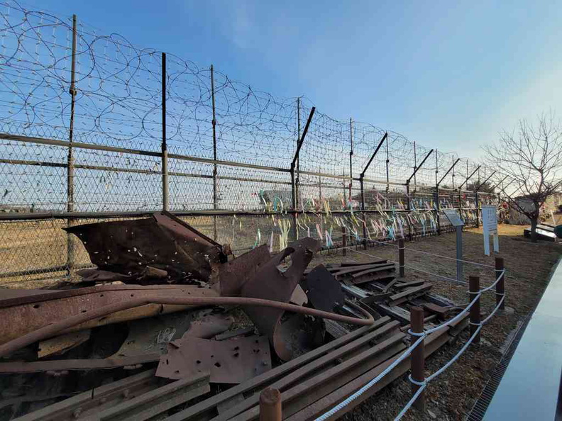 Barbed fences segmenting the public areas from the contested area and minefield