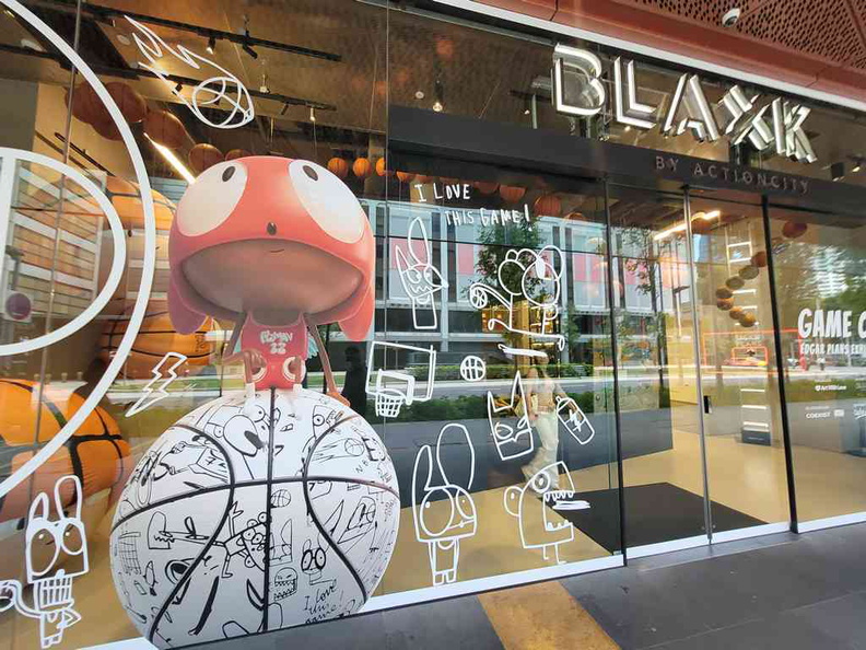 Edgar Plans gallery store front of Blaxk action city in funan