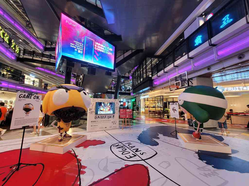 Funan mall atrium stand up displays in the Edgar Plans Game on Global Tour livery