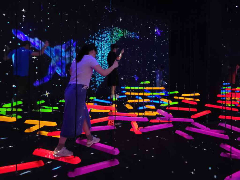 Aerial Climbing through A Flock of Coloured Birds exhibit at the new future world exhibition