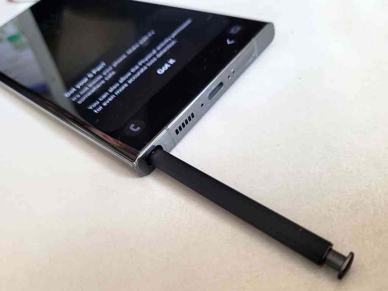 The S-Pen sits in it's own silo which charges within.
