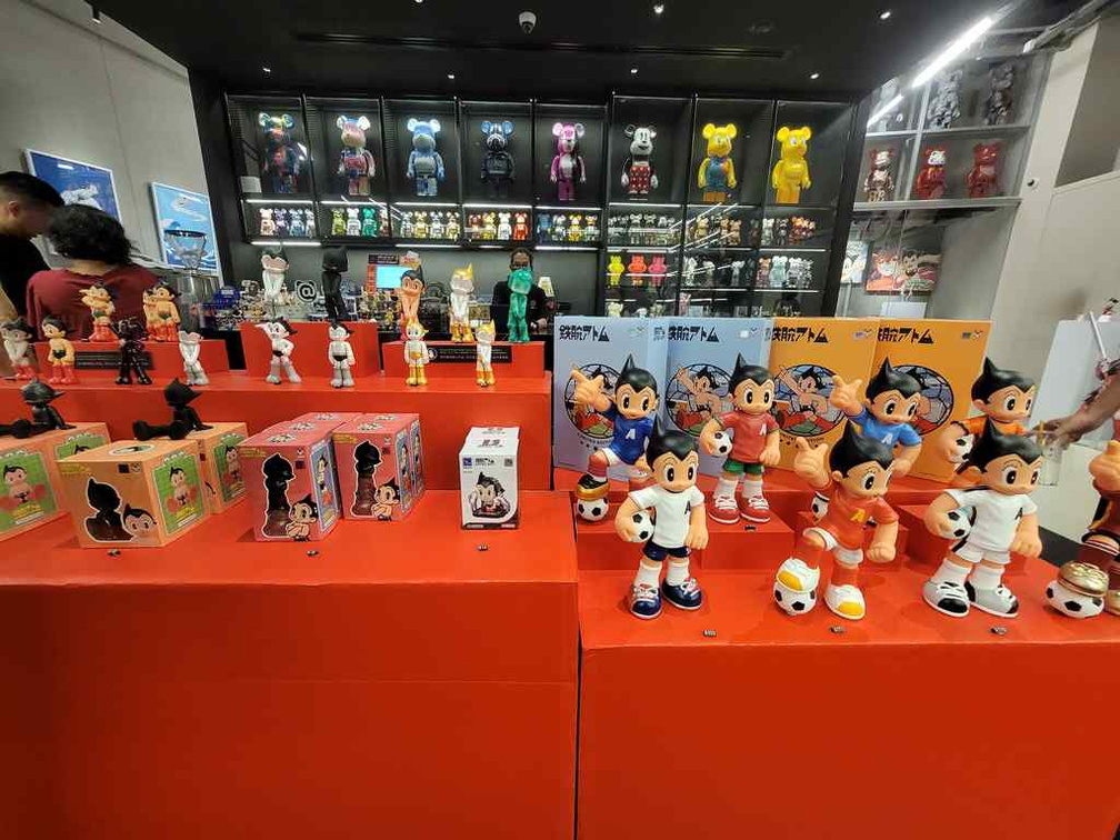 Various Astro Boy toys and memorabilia on display and sale.