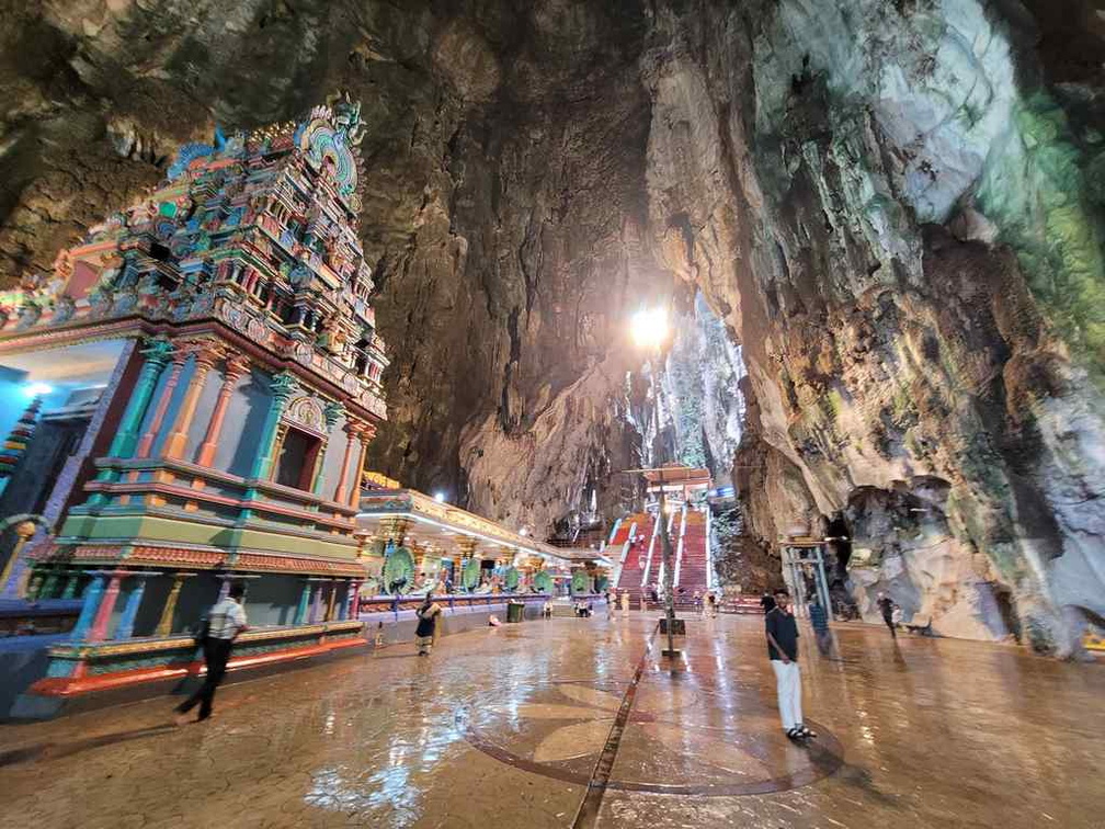 The Murugan temple interior is often wet due to cave rainwater