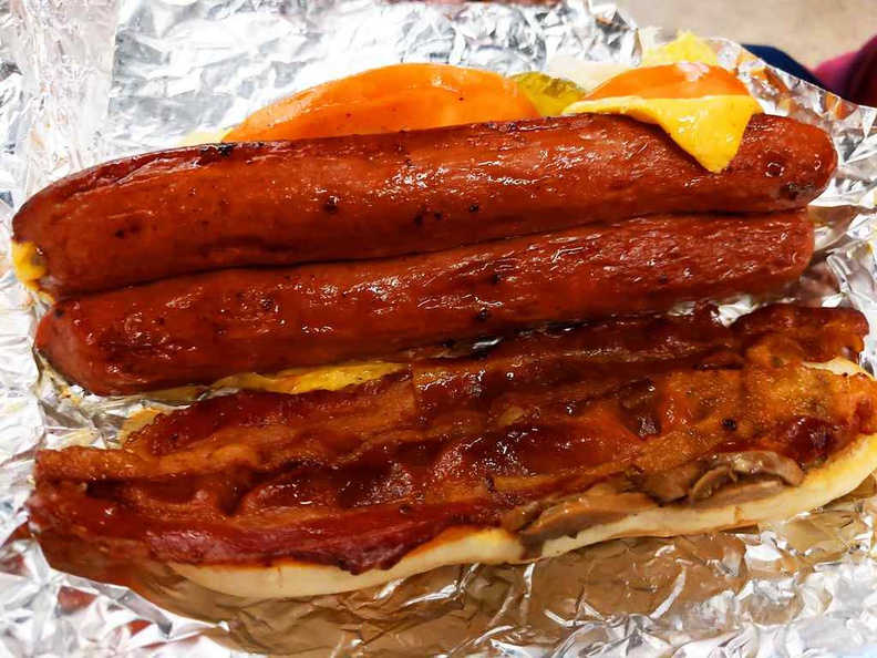 A hotdog ($10), note they are longitudinally sliced and unfolded into your hotdog bun with a matching bacon strip.