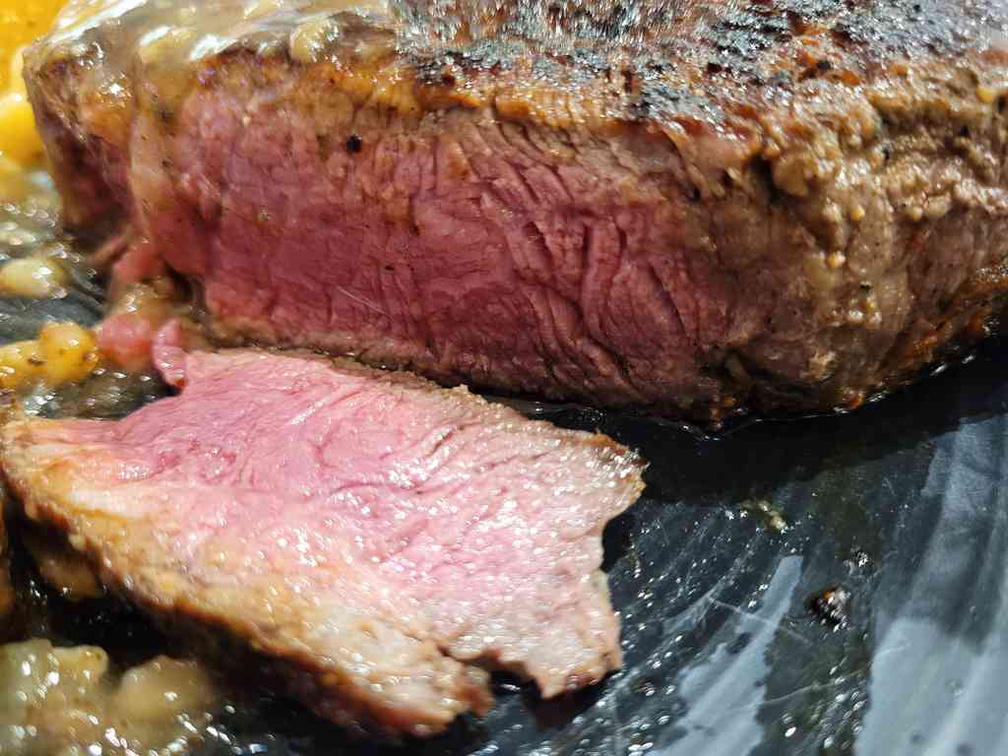 Thick cut steaks done medium-rare.
