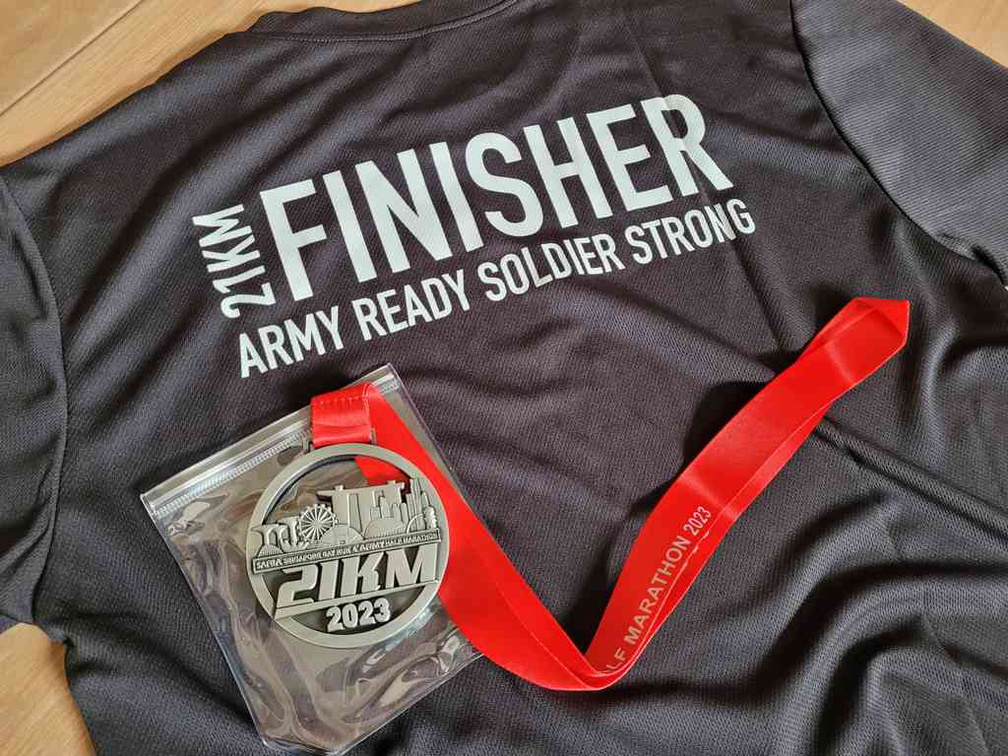 2023 race finisher shirt and medal.