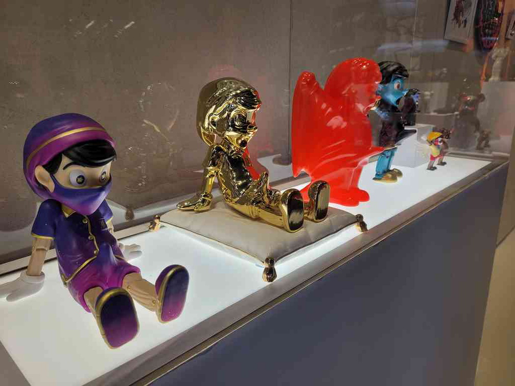 Limited gold Juce Gace Pinocchio pieces also by toymaker MightyJaxx