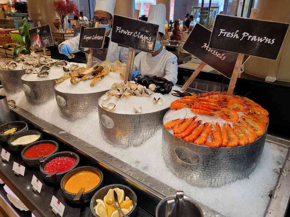 Seafood section with oysters, crayfish, clams and prawns.