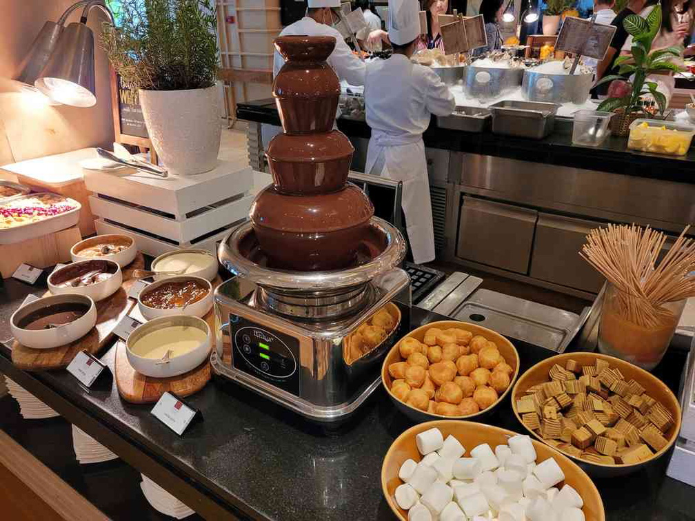 Fondue offering with marshmallows, strawberries and kueh lapis.