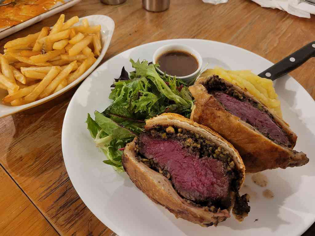 Beef Wellington takes a recommendation with sides of fries.