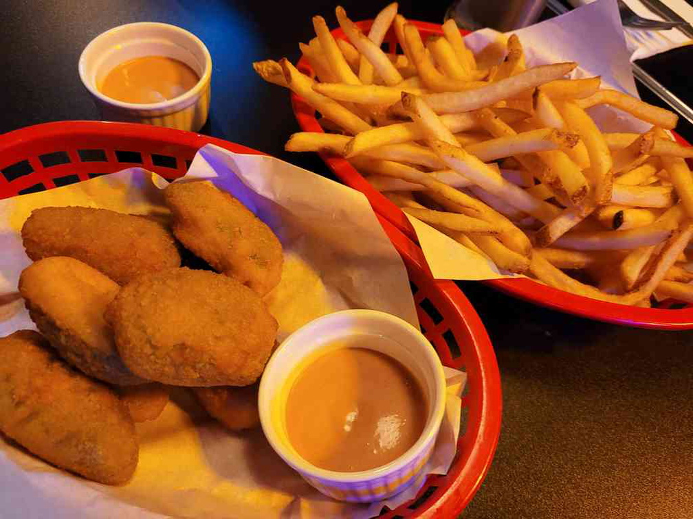 Generous servings of Fries ($6) and Jalapeño poppers ($12) to go with your burgers.
