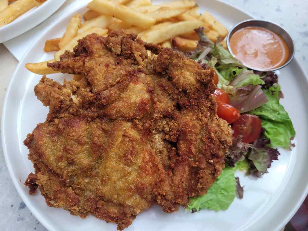 Crispy chicken cutlet with fries ($20).