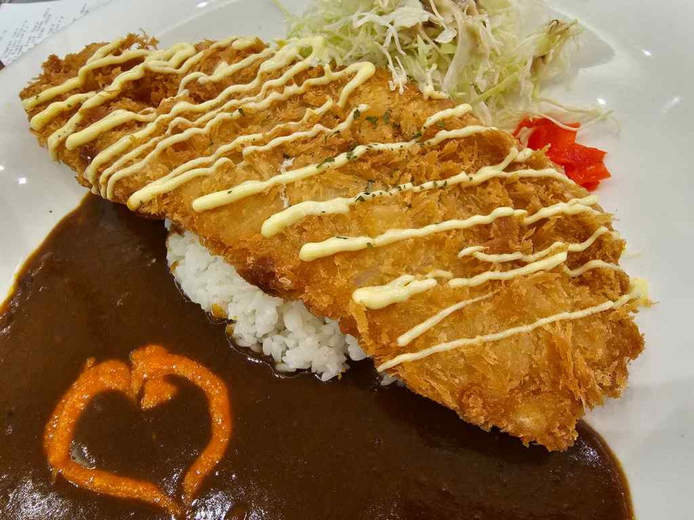 Giant fish cutlet, like fish and chips and rice