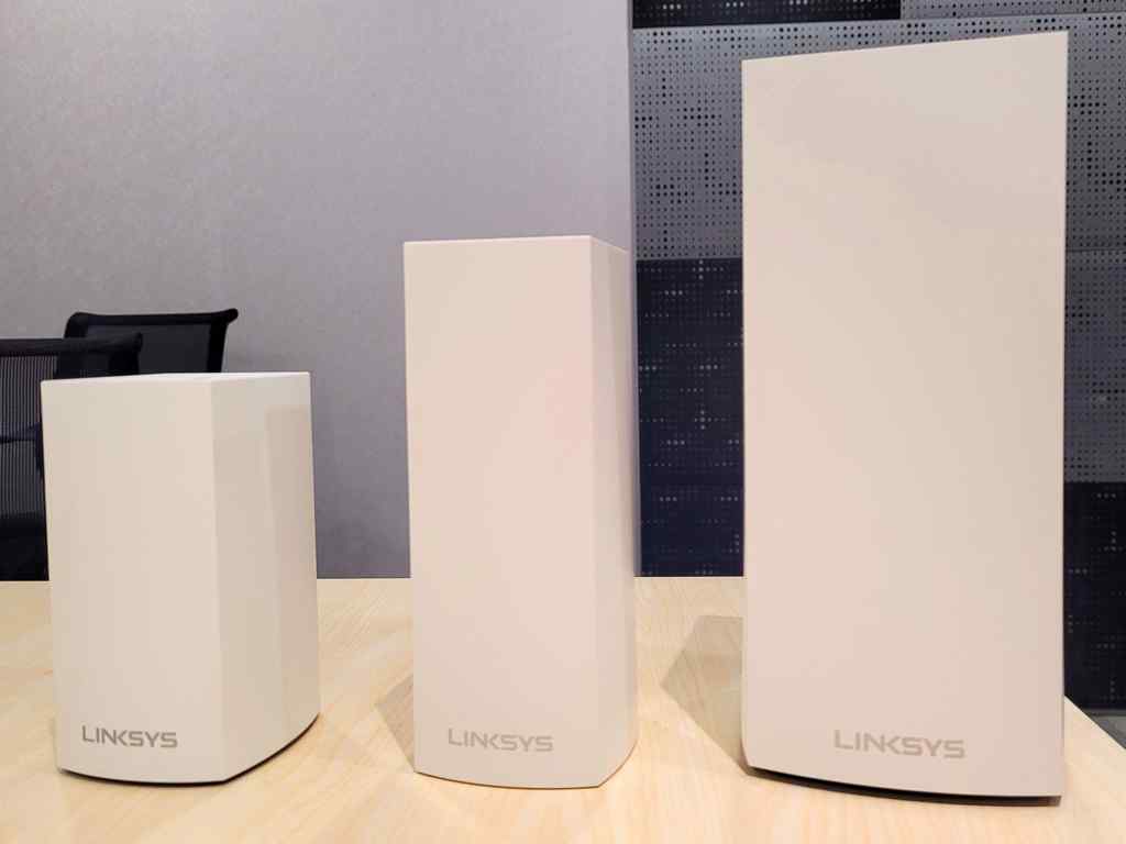Linksys lineup of Velop routers with the Linksys MX4200 Mesh Router on the far right